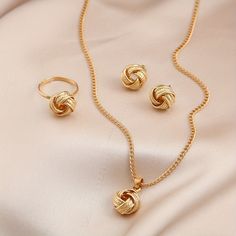 Unleash Timeless Elegance With Our 14k Boho Chic Jewelry Set. This 4-Piece Ensemble, Including Ear Studs, Necklace, And Ring With Braided Pendant, Elevates Any Look Effortlessly. Crafted In Luxurious 14k Gold, Each Piece Exudes Sophistication, Perfect For Impressing Your Crush With Effortless Charm. Jewelry Knots, Gold Jewelry Sets, Studded Necklace, Boho Chic Jewelry, Boho Style Jewelry, Symbolic Jewelry, Necklace Ring, Knot Earrings, Gold Jewellery Design