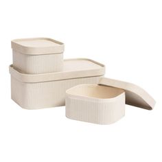 three white storage boxes with lids on each side and one empty container in the middle