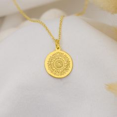 * Celebrate the beauty and joy of nature with our 14K Solid Gold Sunflower Necklace. The sunflower, known for its vibrant energy and positivity, symbolizes happiness, warmth, and growth. Handcrafted with intricate detail, this pendant is perfect for those who appreciate the natural world and the symbolism of light and optimism. Whether worn daily or for special occasions, this handmade necklace is a beautiful reminder of the positive energy that surrounds us. We also offer free engraving on the back, allowing you to personalize it with a name, date, or special message. * Features: * Material: High-quality 14K solid gold for a luxurious and lasting finish. * Design: A beautifully detailed sunflower symbolizing positivity, growth, and joy. * Crafted with Care: Each pendant is meticulously cr Sunflower Jewelry, Sunflower Necklace, Daisy Necklace, Symbolic Jewelry, Solid Gold Necklace, Floral Jewelry, Vibrant Energy, The Sunflower, Pet Necklace