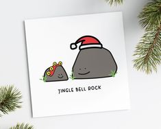 a christmas card with a rock and santa hat