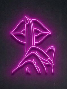 a neon sign that is on the side of a building with a bird in it