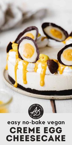 an egg cheesecake on a plate with the words easy no - bake vegan creme egg cheesecake