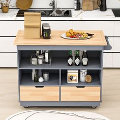 a kitchen island with food and drinks on it