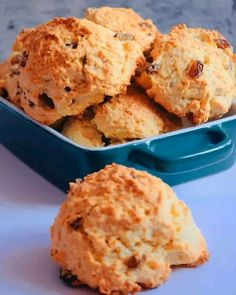 some biscuits are in a blue dish on a table