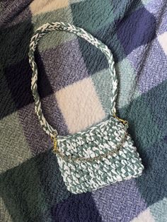 a purse sitting on top of a blanket