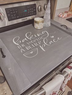 a kitchen stove with the words baking is always nice written on it in white ink