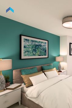 a bedroom with teal walls and white bedding, framed artwork on the wall