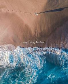 an aerial view of the ocean and sand with words on it that read, good things be ahead