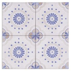 a blue and white tile with circles on it