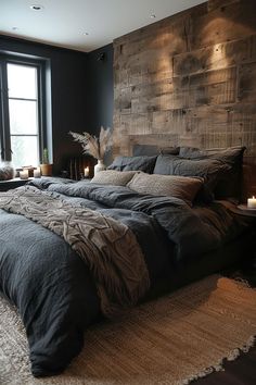 a large bed sitting next to a window in a room with dark walls and wooden headboard