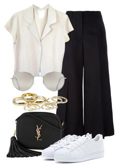 a white shirt and black pants are outfitted with gold accessories, sunglasses, and a handbag