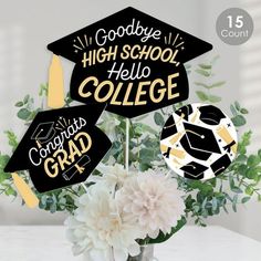 graduation decorations in a vase with flowers