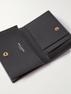 SAINT LAURENT's holder is designed to stash your business cards and has some extra slots for the essentials, too. It's been made in Italy from black leather and appliquéd with a signature logo in gold-tone metal. Passport Holder Aesthetic, Designer Leather Wallet, Saint Laurent Card Holder, Wallet Aesthetic, Ysl Card Holder, Designer Card Holder, Saint Laurent Collection, Leather Wallet Design, Ysl Wallet