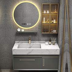 a bathroom vanity with a round mirror above it and lights on the wall next to it