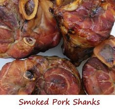 smoked pork shanks on a white plate with the words smoked pork shanks above them