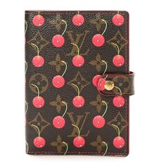 This is an authentic LOUIS VUITTON Monogram Cerises Small Ring Agenda Cover. This stylish agenda cover is crafted of monogram coated canvas with an overlay print of cherries with smiling faces. The cover opens with a snap to a cherry red cross-grain leather interior with card slots, flat pockets, and a polished brass six-ring binder with inserts. Agenda Cover, Smiling Faces, Small Ring, Small Rings, Red Cross, Ring Binder, Smile Face, Cherry Red, Leather Interior