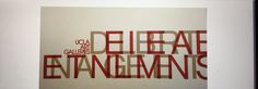 an art piece with the words delirae entanglements in red and white