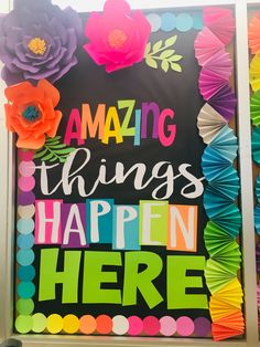 an art project with colorful paper flowers and the words amazing things happen here