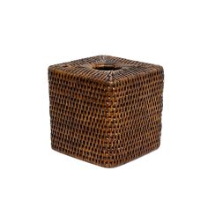 a square brown basket sitting on top of a white surface