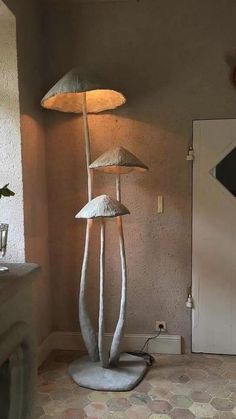 a lamp that is sitting on top of a table next to a mirror and door