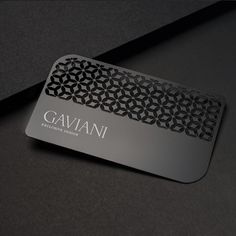 a black and silver business card with the name gavanii on it's side