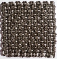 the crocheted square is made up of two rows of gray and white yarn