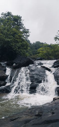 the water is rushing over the rocks in the river