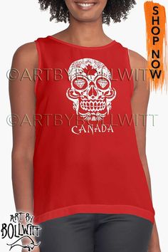 a woman wearing a red tank top that says canada with a white skull on it