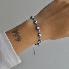 Get ready to have all eyes on you with our Nazar Bracelet! This stunning bracelet will make any outfit stand out. Complete the set with our Nazar Necklace and Nazar Anklet! Nazar Necklace, Nazar Bracelet, Hand References, Concert Hairstyles, Hairstyles Long, All Eyes, Belly Rings, Blue Bracelet, All About Eyes