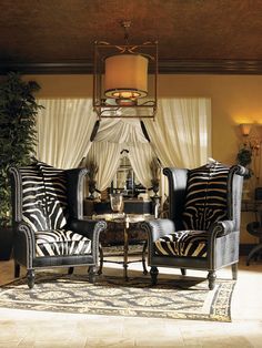 a living room with zebra print furniture in it