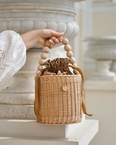 "Straw summer bucket bag with wooden handle and inside cotton bag. It is carefully hand-made by local artisans. This fashionable, stylish and environmentally-friendly basket is perfect for everyday use or going out. Basket have fantastic proportions. Wicker basket can be ideal gift for your mum, sister or friend! Check out more details and \"how it is made\" on my instagram @medvilniukas. Features: - a precisely handmade basket made in Lithuania - made from all-natural and sustainable materials Natural Top Handle Crochet Bag For Spring, Natural Color Crochet Bag With Top Handle For Spring, Natural Crochet Bag With Top Handle For Spring, Spring Natural Crochet Bag With Top Handle, Natural Straw Bag With Round Handle For Summer, Trendy Summer Basket Straw Bag, Summer Natural Straw Bag With Round Handle, Chic Summer Beach Bag With Round Handle, Natural Top Handle Straw Bag For Day Out