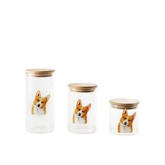 three glass jars with small dogs on them