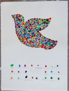 a piece of paper that has been made to look like a bird with colorful dots on it