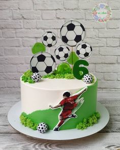 a birthday cake with soccer decorations on it