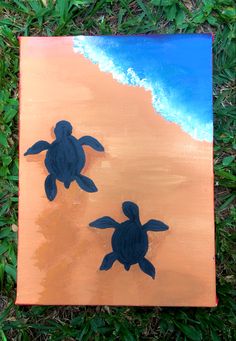 two sea turtles painted on an orange and blue canvas with green grass in the background