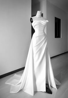 a white dress on display in a room