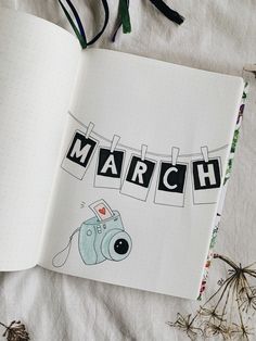 an open notebook with the word march written in it