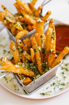 french fries with parmesan sprinkles and ketchup on a plate