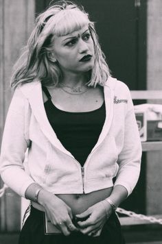 black and white photograph of a woman with her hands in her pockets