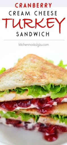 a sandwich with cranberry sauce and lettuce on toasted bread is sitting on a white plate