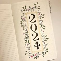 an open notebook with the year 2014 written on it