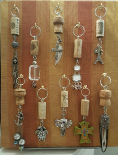 a wooden board with many different types of key chains hanging from it's sides