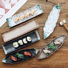 sushi and chopsticks on a wooden table