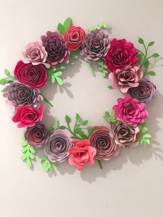 paper flowers arranged in the shape of a wreath