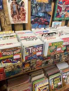 there are many comics on display in the store