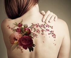 a woman with flowers painted on her back