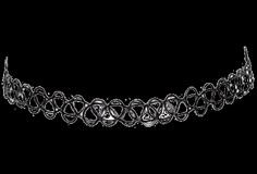 a black and white photo of a headband with circles on it's side