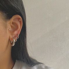 Silver Earrings 3 Holes, Silver Hoop Piercings, Silver Earrings Set Up, Minimal Ear Piercings Silver, Silver Earrings Layered, Layered Silver Earrings, Mix Gold And Silver Earrings, Curated Ears Silver, Silver Hoop Earrings Chunky