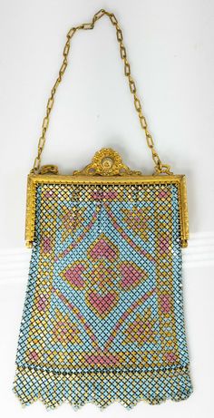 Purse Antique Whiting & Davis enamel and mesh purse with great art nouveau purple and teal stylish decoration. Some items we offer have age and wear, this wear due to age may include breaks, repairs, repainting, or restoration, we try to call this damage as well as possible but please refer to the photography for a full description. HEIGHT 6 7/8 inches 17.5 cm WIDTH 4 5/8 inches 11.9 cm We do not guarantee the age of any piece we sell, we are not experts on age and can only describe the items to Silver Bag, Vintage Evening Bags, Pattern Purse, Bracelet Love, Metallic Purse, Metallic Bag, Antique Clothing, Vintage Purses, Pink Enamel