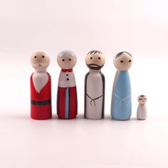 a group of wooden dolls standing next to each other